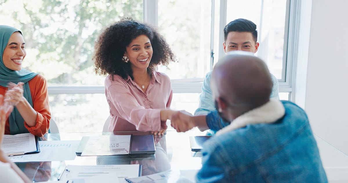 People having a handshake in the office
